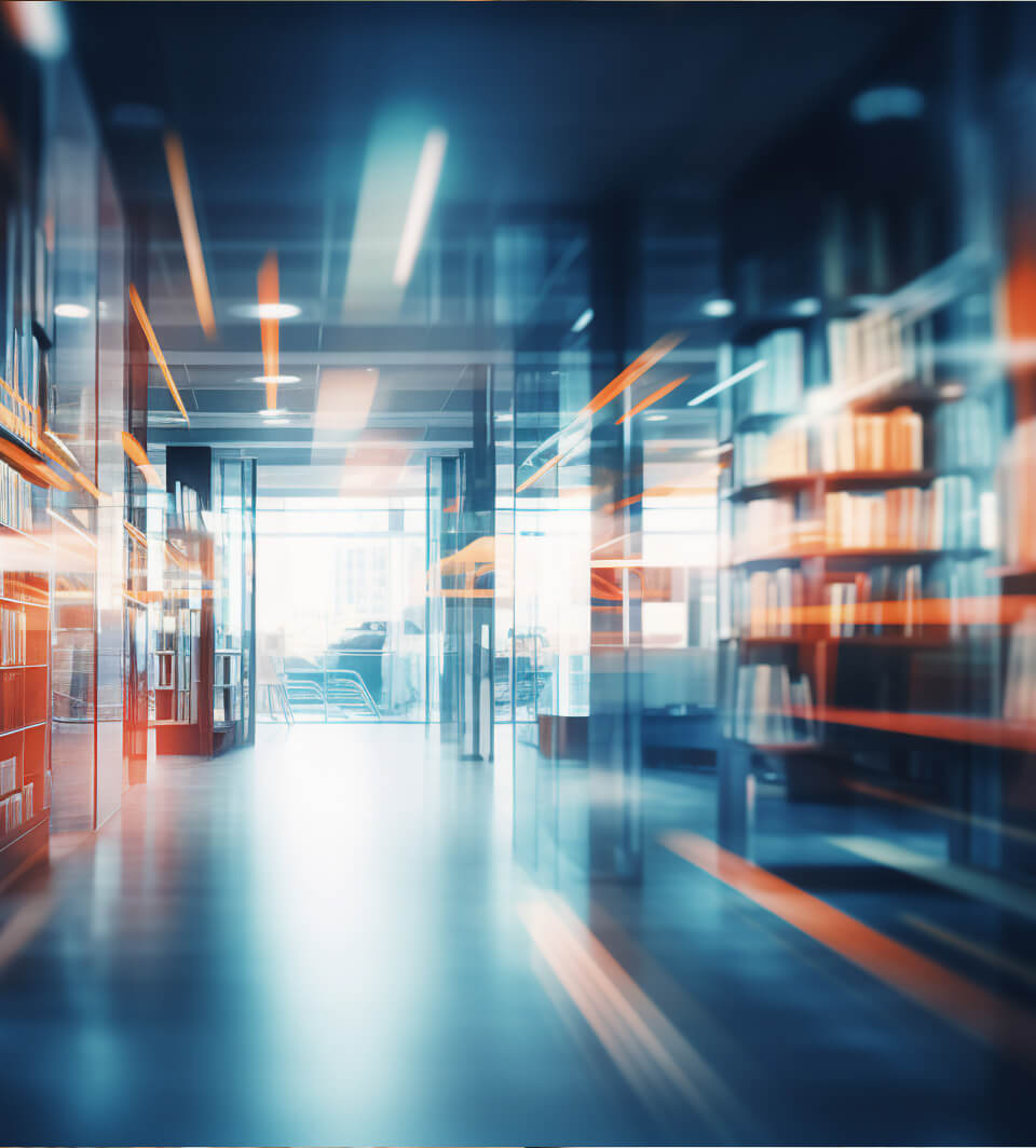 Abstract image of a library with a view down the walkway between bookshelves